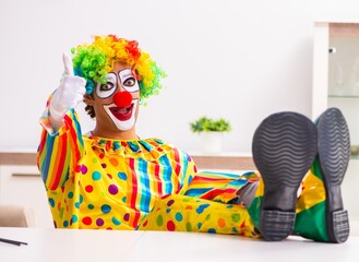 Male clown preparing for perfomance at home
