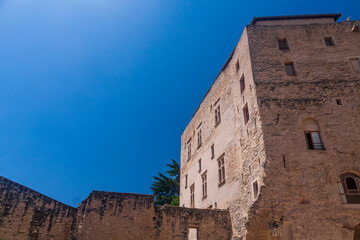 Naklejka premium Ruin of a old castle in a village in Provence Avignon under a blue sky in a sunny day