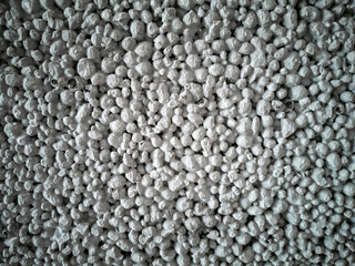 Dark gray background of a waterproofing foam block for a bathroom. Construction and repair, wallpaper.