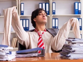 Crazy young man in straitjacket at the office