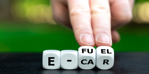 Symbol for using e-fuels. Hand turns dice and changes the expression 