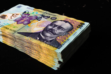 Closeup shot of a 100 leu banknotes stack