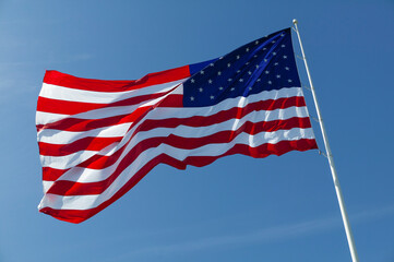 American flag against a blue sky