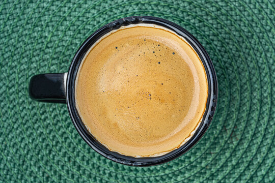 coffee espresso on a green background top view