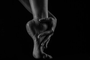 Black and white image of a beautiful female body. Studio shooting with backlight. Sexy body. healthy female body concept in black and white