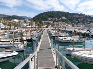 Fototapeta na wymiar Jetty in the Marina of Port de Soller, Mallorca, Balearic Islands, Spain, with the Tramuntana mountains in the background
