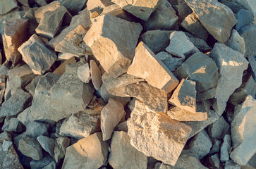Stone, large chipped pieces of rubble. Construction background