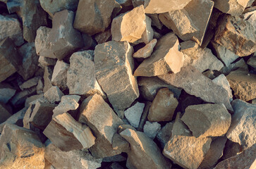 Stone, large chipped pieces of rubble. Construction background