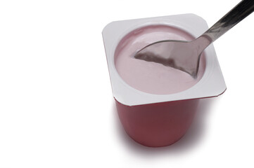 Closeup fruit yogurt children spoon white background