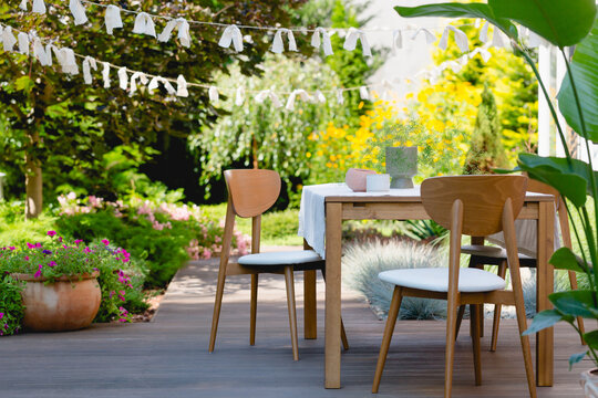 Ooden table and chairs in the summer garden
