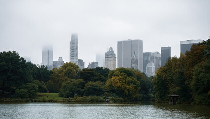 New York skyscrapers on a rainy day seen from Central Park lake