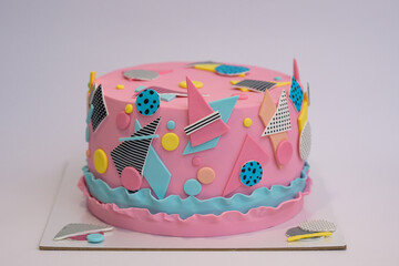 Photo of pink fondant cake with decorations