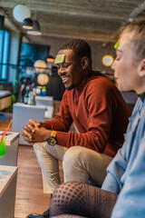 Laughing and guessing their word while thinking a lot