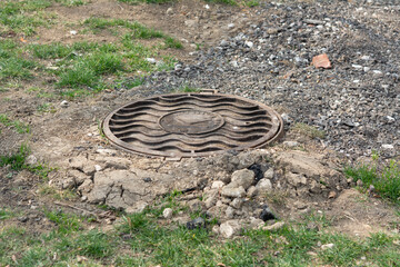 Tiraspol, Moldova - March 25, 2022 Sewage manhole cover with serial number of local company.