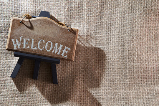 welcome signage on jute background