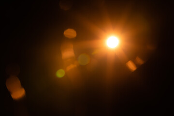 Solar lens flare on black background