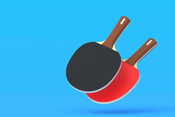 Ping pong paddles on blue background. Game for leisure. Sport equipment. International competition. Copy space. 3d render