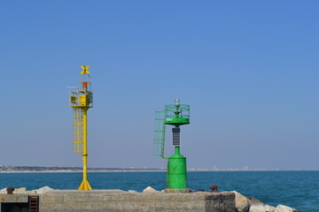 Fototapeta na wymiar We are located in Cesenatico, an Italian town in Romagna, on the coast of the Adriatic Sea. Details of port lighthouses.