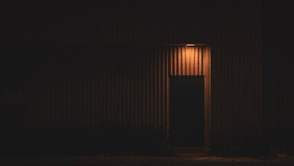 Back door and warm lamp at night