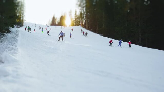 Group of skiers ski down the ski slope