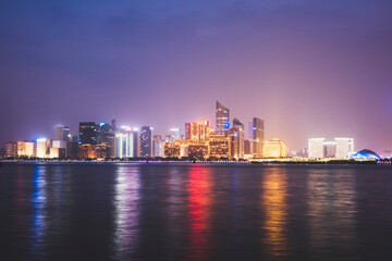 Fototapeta na wymiar Hangzhou Qianjiang New Town urban business center is reflected on the river