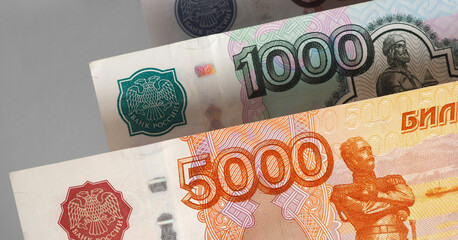 Russian banknotes 5000 and 1000 rubles. Numerals of denomination of bills close-up. Economy money and finance in Russia. Salaries and government benefits. Horizontal stories. Macro