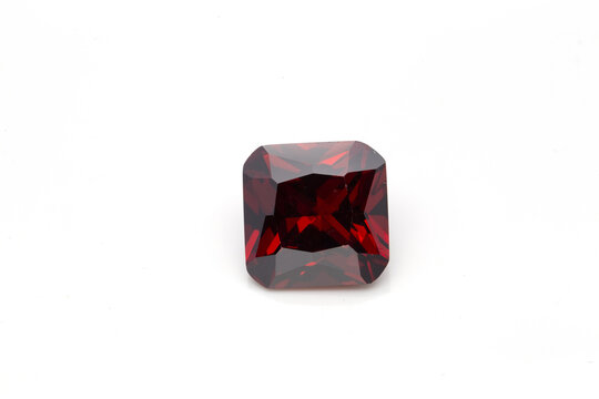 Closeup of a red ruby gemstone isolated on a white background