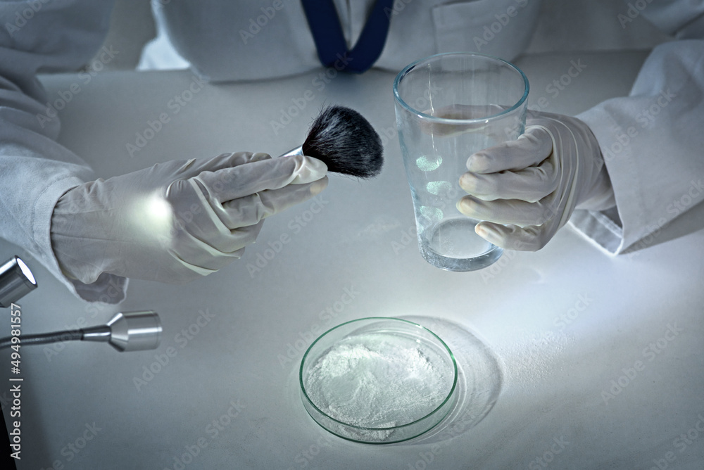 Aufkleber Dusting for prints. High angle shot of an unrecognizable female forensic scientist dusting for prints in the lab.
