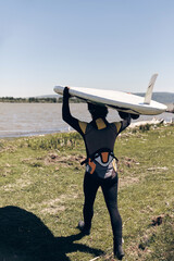 Windsurfer on a windy summertime day at the lake.