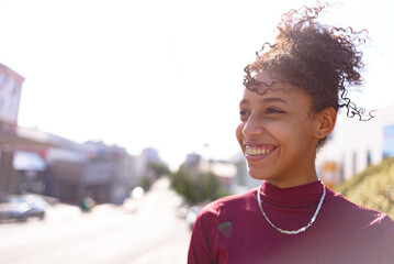 Black young woman portrait outdoors in urban landscape