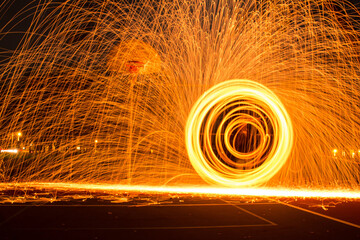 Beautiful steel wool long exposure image outdoors at night - perfect for wallpapers