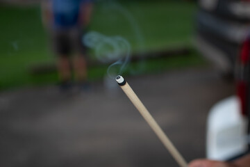 Closeup of an incense stick with smok © John Robinson/Wirestock Creators
