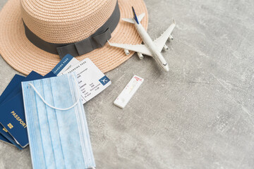 Airplane in flight with a medical mask. Concept - observance of safety on the plane. Traveling by air at social distance. Compliance with the recommendations of doctors on trips. Opening borders.