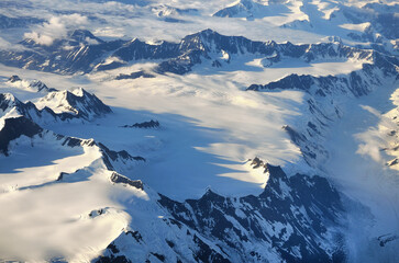 Aerial view of Alaska mountains buried in clouds