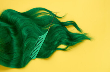Unusual bright green natural hair colored with pigments on yellow. Beauty salon background for stories. - 494986971