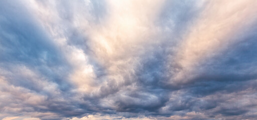 Beautiful dramatic sky at sunset or dawn with dark blue clouds