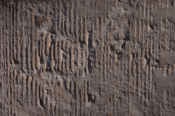 brown background, in the photo a brown concrete wall close-up.