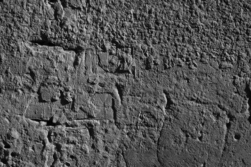 gray background, in the photo, gray concrete wall close-up.