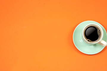 cup of coffee isolated on orange background.  hello Monday concept , back to work 