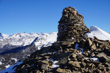 stone cairn in the southern alps, france in winter