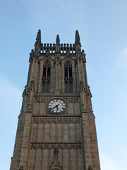 Fototapeta na wymiar a close up of the tower and clock of leeds parish church in west yorkshire