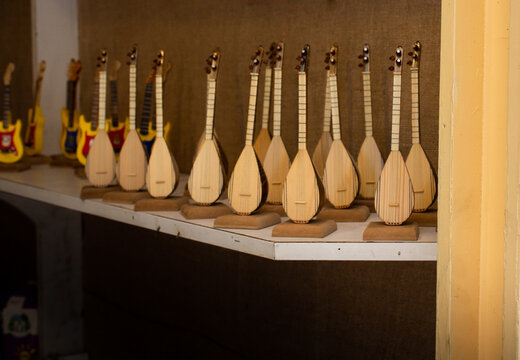 Closeup shot of wooden dutars on the white table