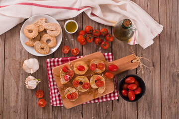 Friselle with cherry tomatoes and olive oil.