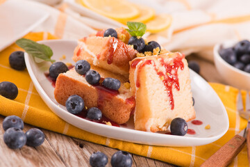 Lemon pund cake with blueberries and strawberry syrup.