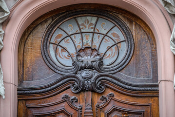 Fototapeta na wymiar Decorative part of portal, entrance to the House of Scientists. The building of the former noble casino. Lviv, Ukraine.