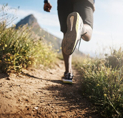 Running is my escape. Low angle shot of an unrecognizable man out running.