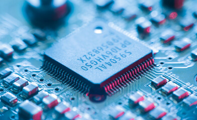 Computer Microchips and Processors on Electronic circuit board.  Computer hardware technology. Abstract technology microelectronics concept background. Macro shot, shallow focus.
