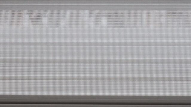 the roller blind of a window opens
