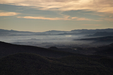 Fototapeta na wymiar Misty landscape in Santa Maria de Besora