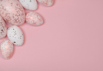 Fototapeta na wymiar Decorative Eggs with Silver and Black Spots Lying on a Pink Background. Modern Easter Holiday Composition with White and Pink Spotted Eggs ideal for Banner, Card, Greetings. Top-Down View. No text.